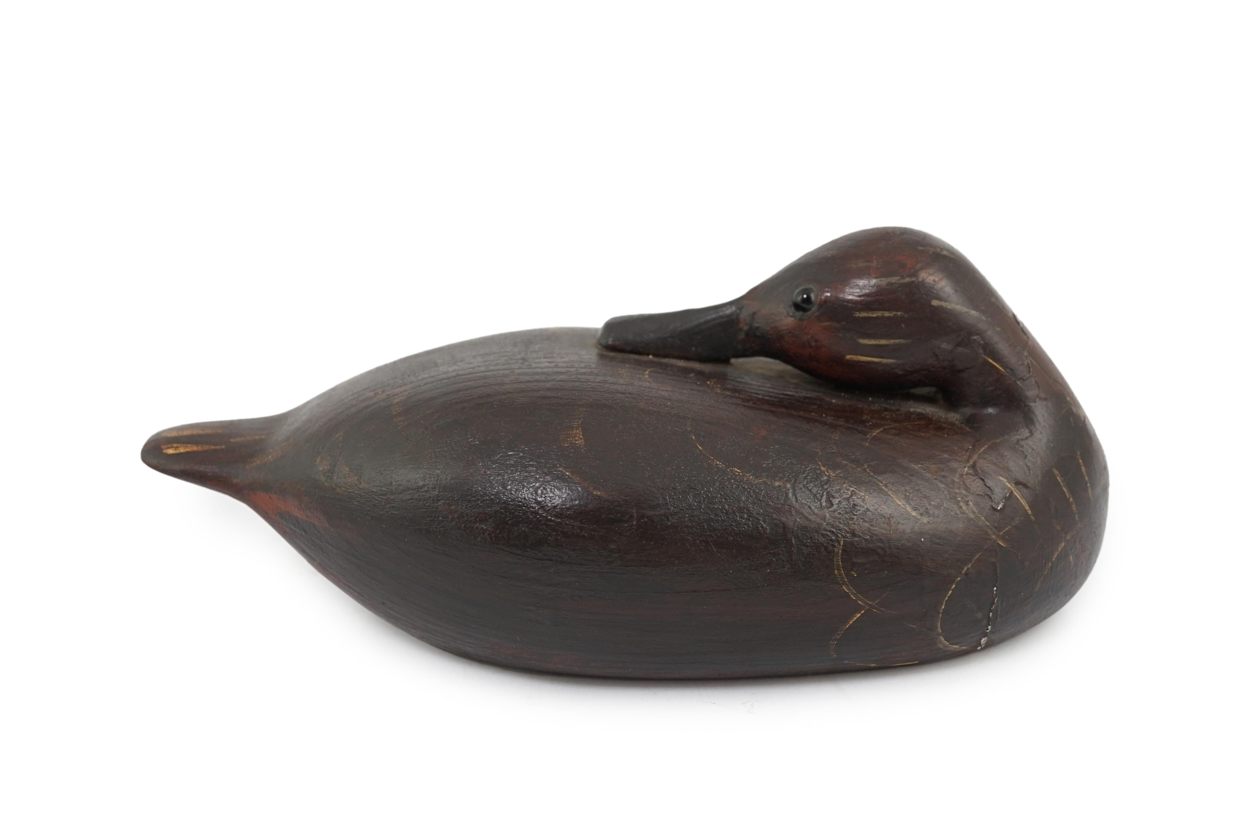 Guy Taplin (British, b.1939), a carved and painted oak model of a duck